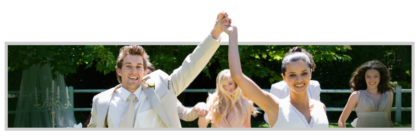 Wedding Couple Holding Up Their Hands in Triumph